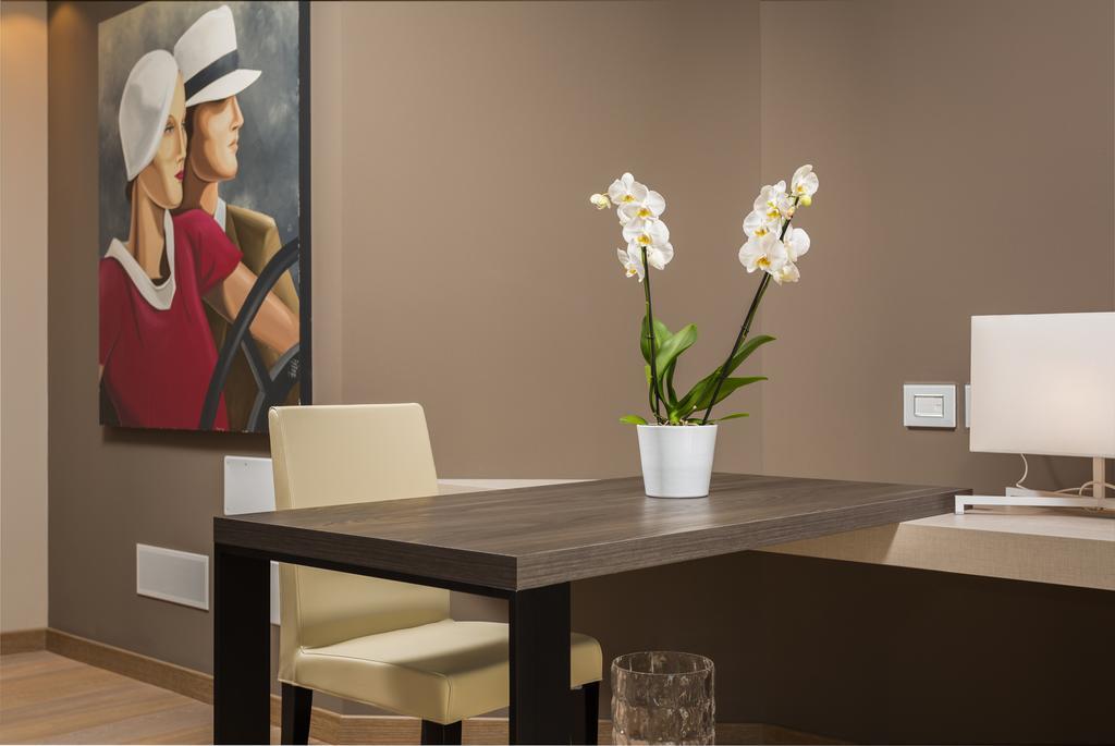 Suites Hotel Astor Belluno Szoba fotó