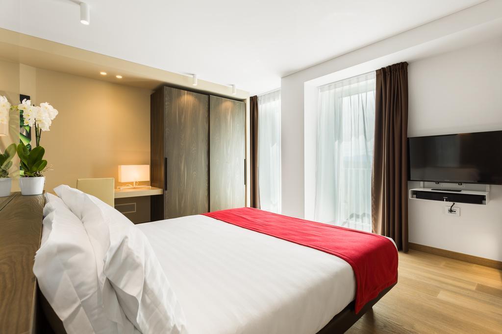 Suites Hotel Astor Belluno Szoba fotó