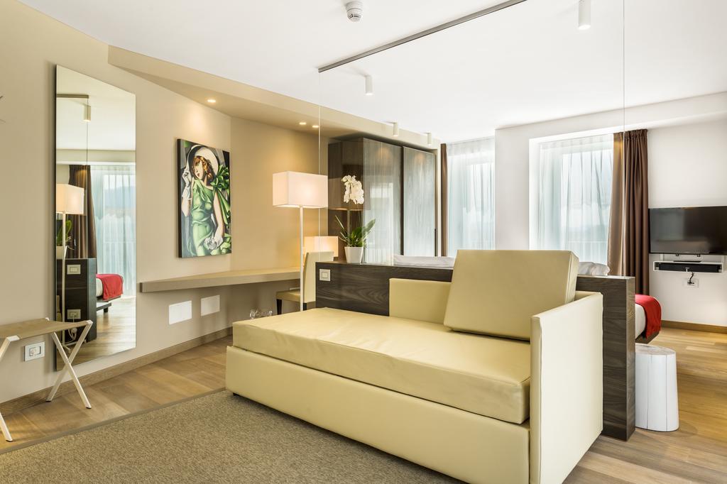 Suites Hotel Astor Belluno Szoba fotó